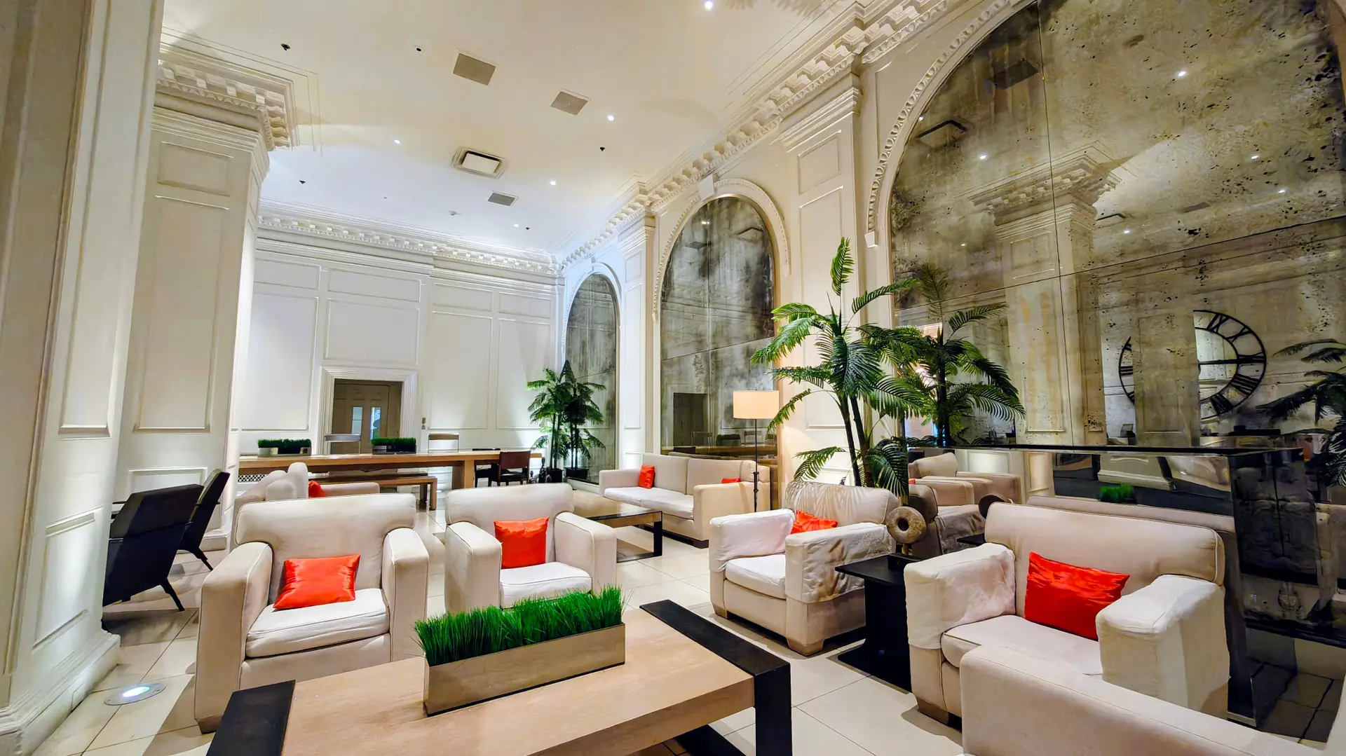 Historic Ambassador Gold Coast hotel lobby with arched mirrors and lounge seating in Chicago
