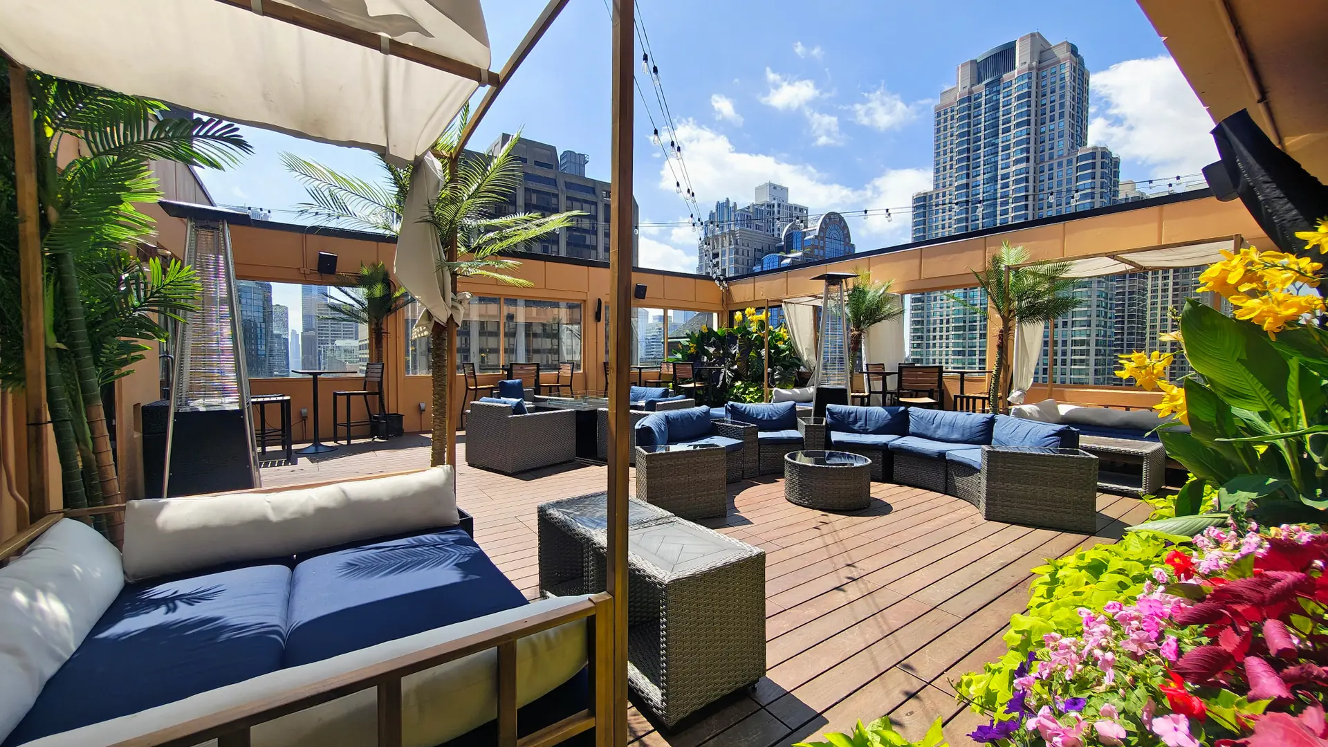 Daytime outdoor seating, flowers and Chicago skyline views at Skydeck at Twenty Nine