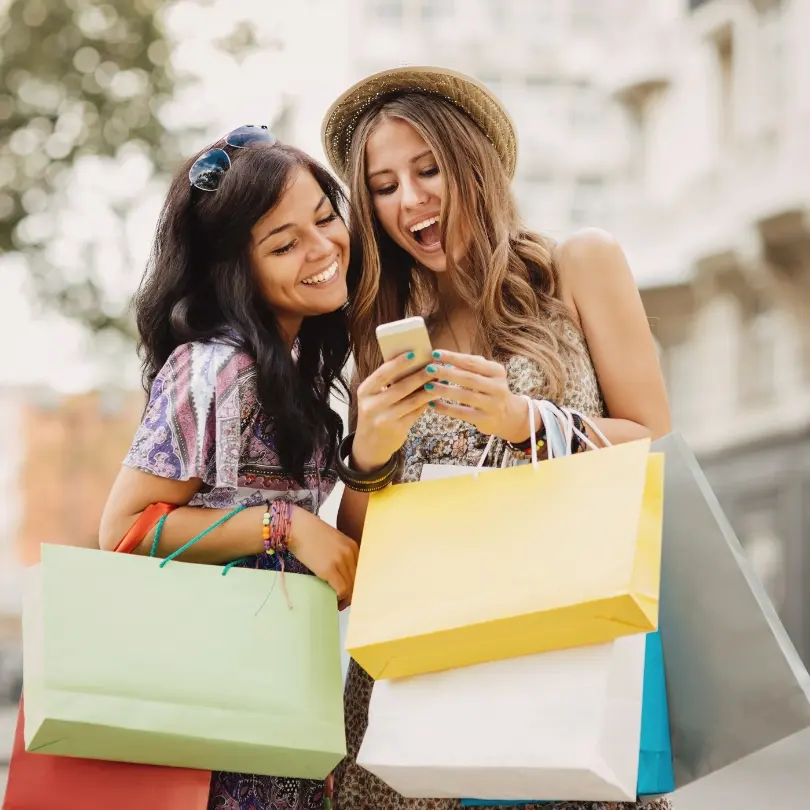 Shoppers carrying colorful retail bags