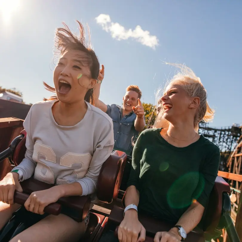 Family enjoying a theme park ride